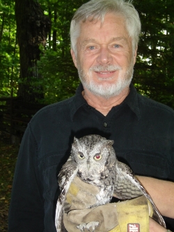 photo of Doug with screech owl
