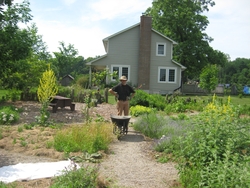 photo of Sean working in herb garden